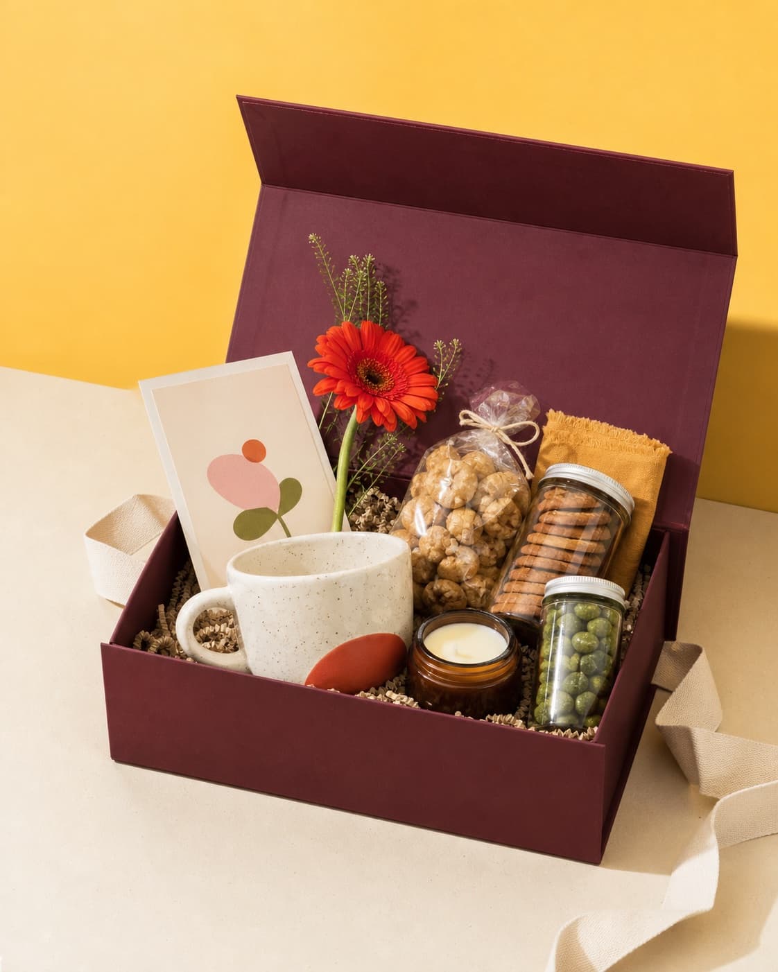 Open mulberry celebration hamper on a warm butter background