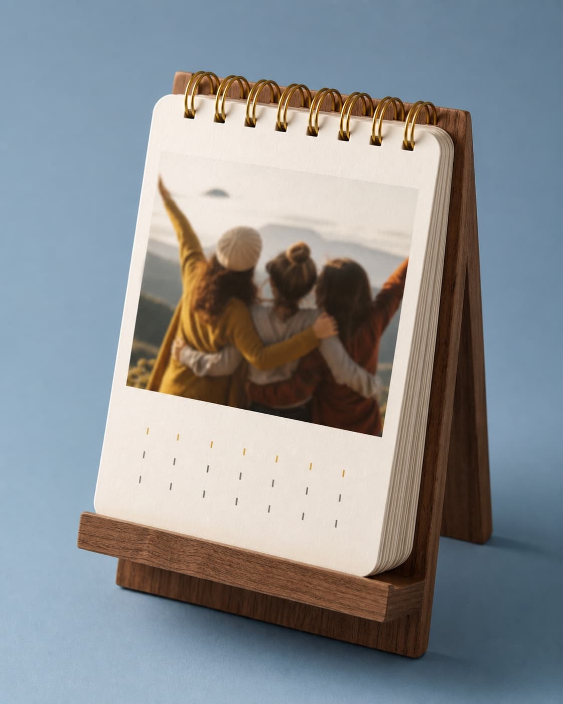 Photo desk calendar on a dusty blue background